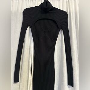 NWT. Black ribbed sweater dress. Turtle neck and cut out design.